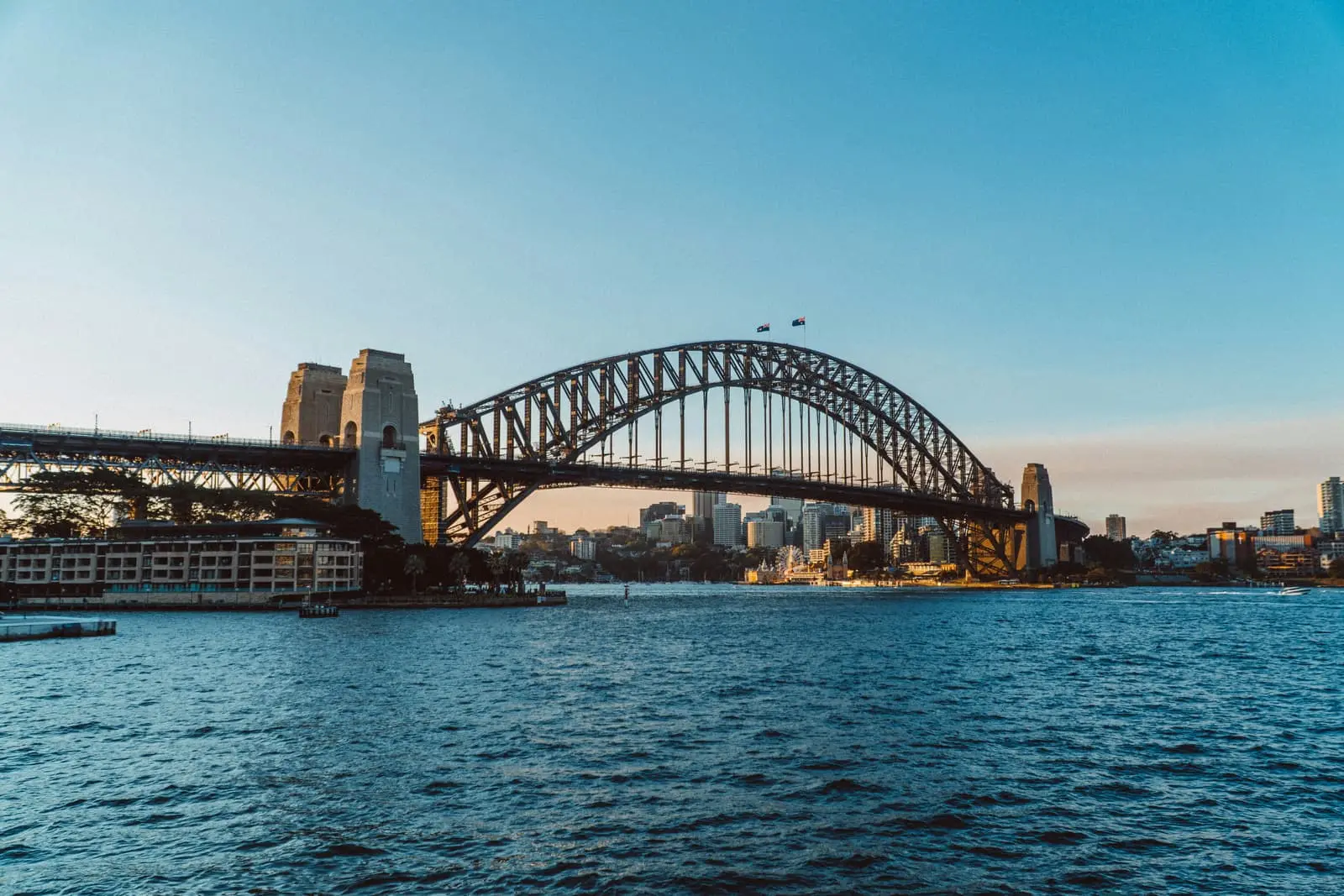 Bridge spanning water in a city during daytime